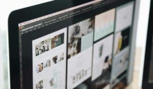 A modern computer screen displaying web design work, showcasing creative visuals in a workspace. — Photo by Tranmautritam on Pexels