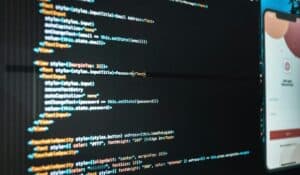 Computer screen with program code and app during work in workplace of modern office — Photo by Rodrigo Santos on Pexels