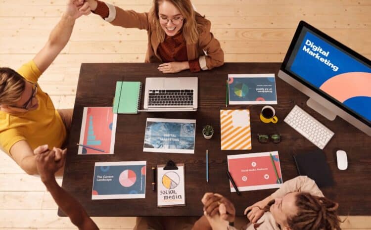 Colleagues celebrating success in a modern digital marketing office with teamwork and collaboration. — Photo by Mikael Blomkvist on Pexels
