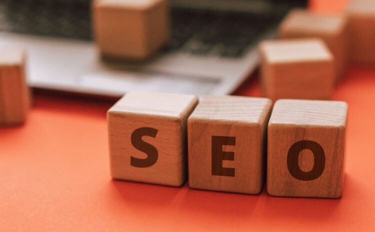 Wooden blocks spelling SEO on a laptop keyboard convey digital marketing concepts. — Photo by Atlantic Ambience on Pexels