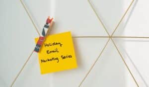Bright yellow sticky note with holiday email marketing message clipped to a wireframe wall. — Photo by Walls.io on Pexels